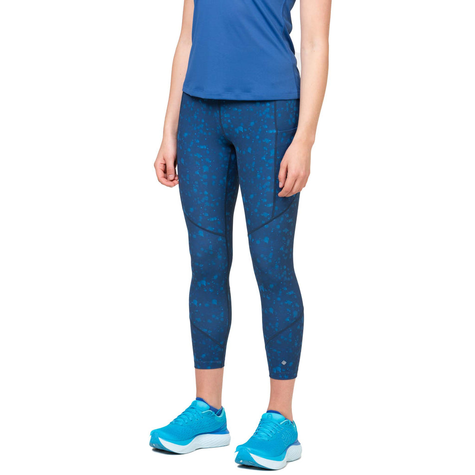 Front view of a model wearing the Ronhill Women's Tech Crop Tight in the Tidal Raindrops colourway. (8564970619042)