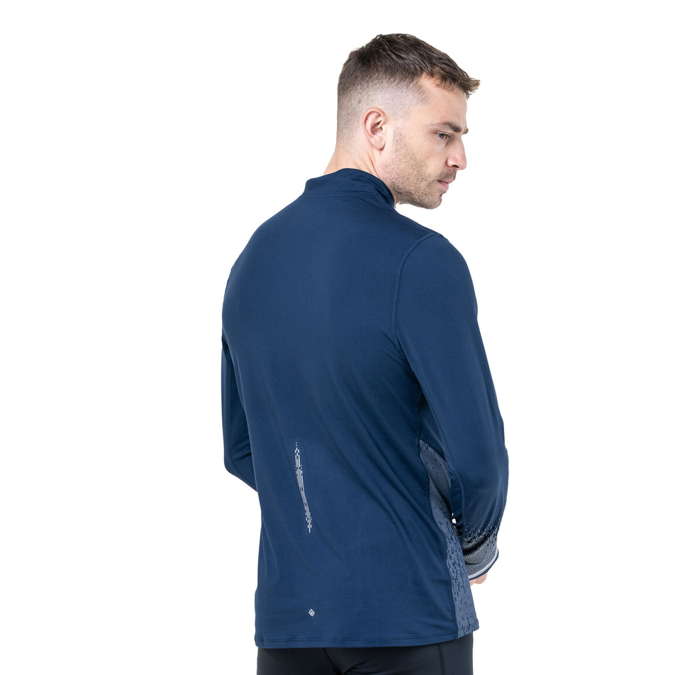 Back view of a model wearing the Ronhill Men's Tech Reflect 1/2 Zip in the Dark Navy/Reflect colourway. (8742775455906)