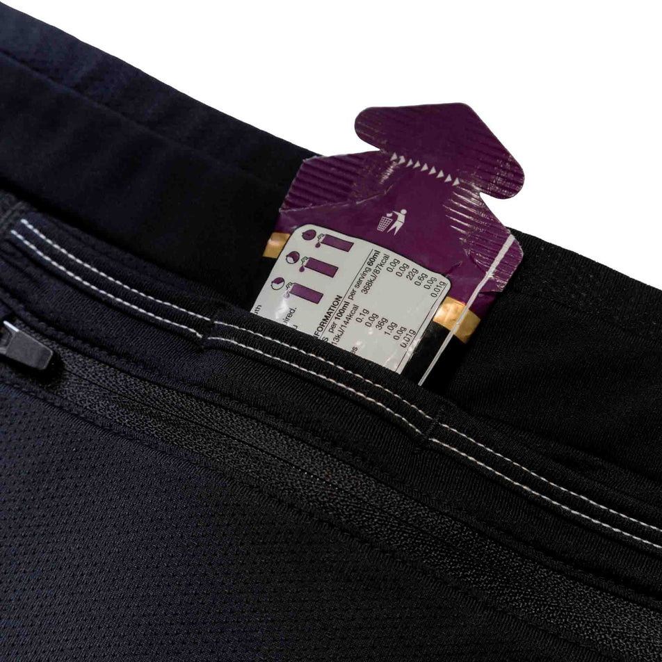 An energy gel in one of the built-in storage pouches on the back of the Ronhill Tech Paragon Tights' waistband. (8490275864738)