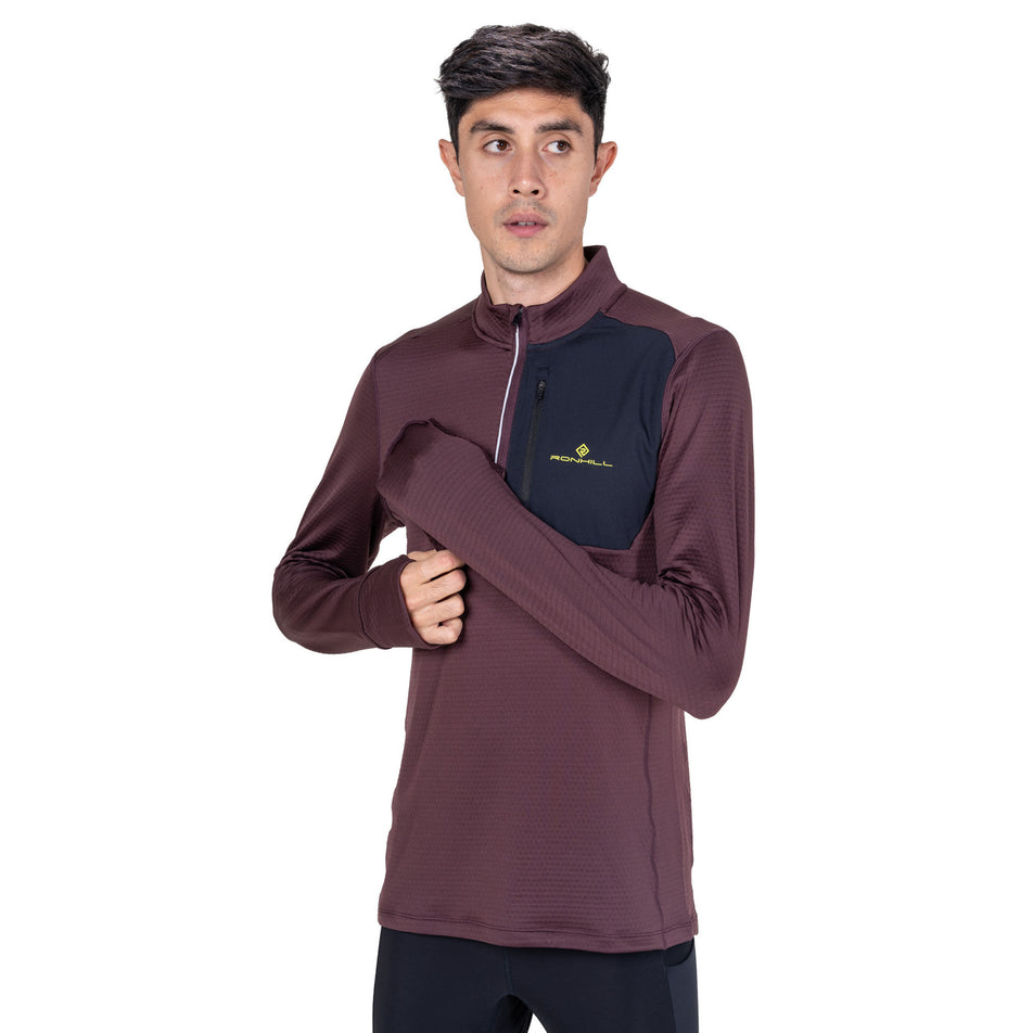 Front view of a model wearing the Ronhill Men's Tech Winter 1/2 Zip in the Espresso/Black colourway.