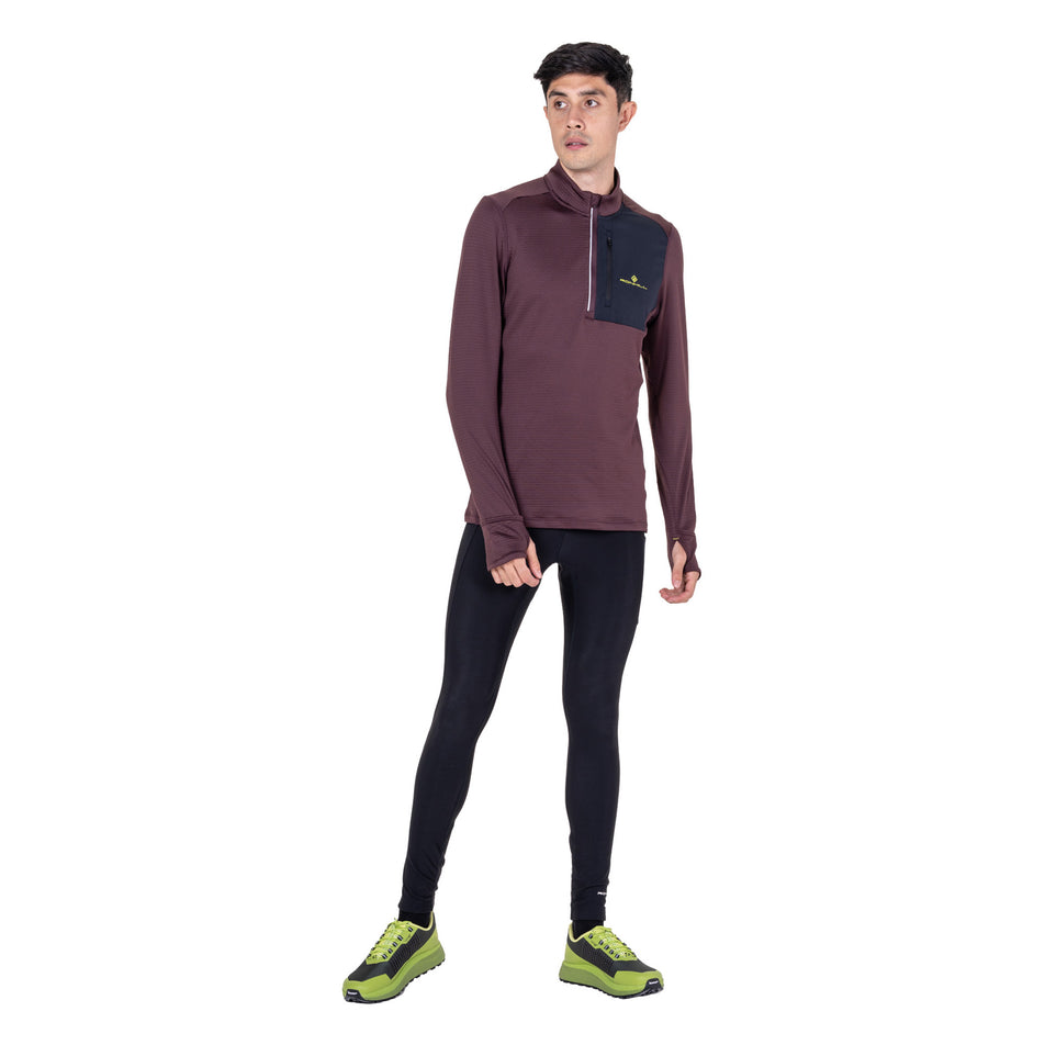 Front view of a model wearing the Ronhill Men's Tech Winter 1/2 Zip in the Espresso/Black colourway.