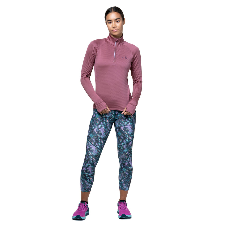 Front view of a model wearing the Ronhill Women's Tech Winter 1/2 Zip in the Dusty Tulip/Dark Navy colourway. (8747552211106)
