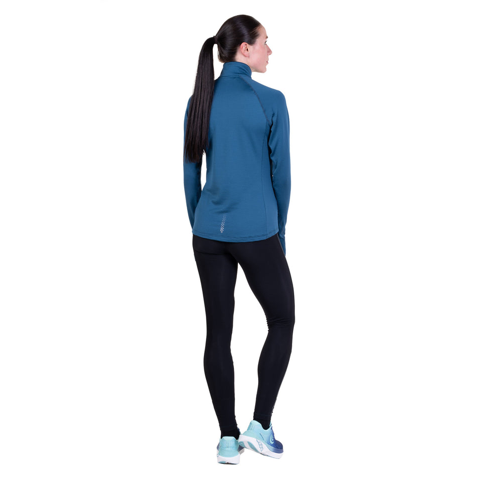 Back view of a model wearing the Ronhill Women's Tech Winter 1/2 Zip in the Legion Blue/Orchid colourway.