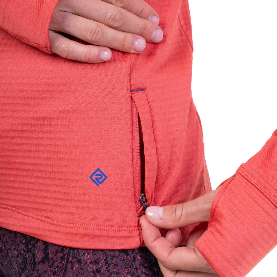 The zip pocket on the Ronhill Women's Tech Winter 1/2 Zip in the Sumac/Blue Violet colourway.
