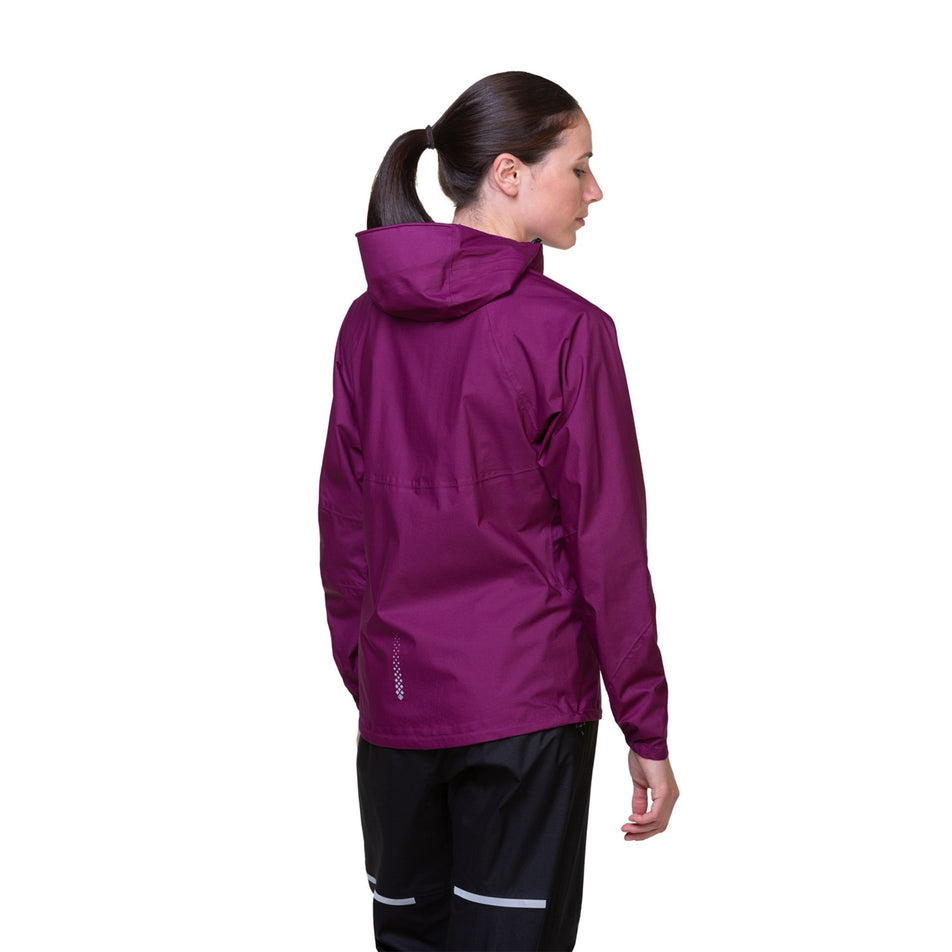 Back view of a model wearing a Ronhill Women's Tech Fortify Jacket in the Blackcurrant/Mango colourway. Model is also wearing trousers. (8469350121634)