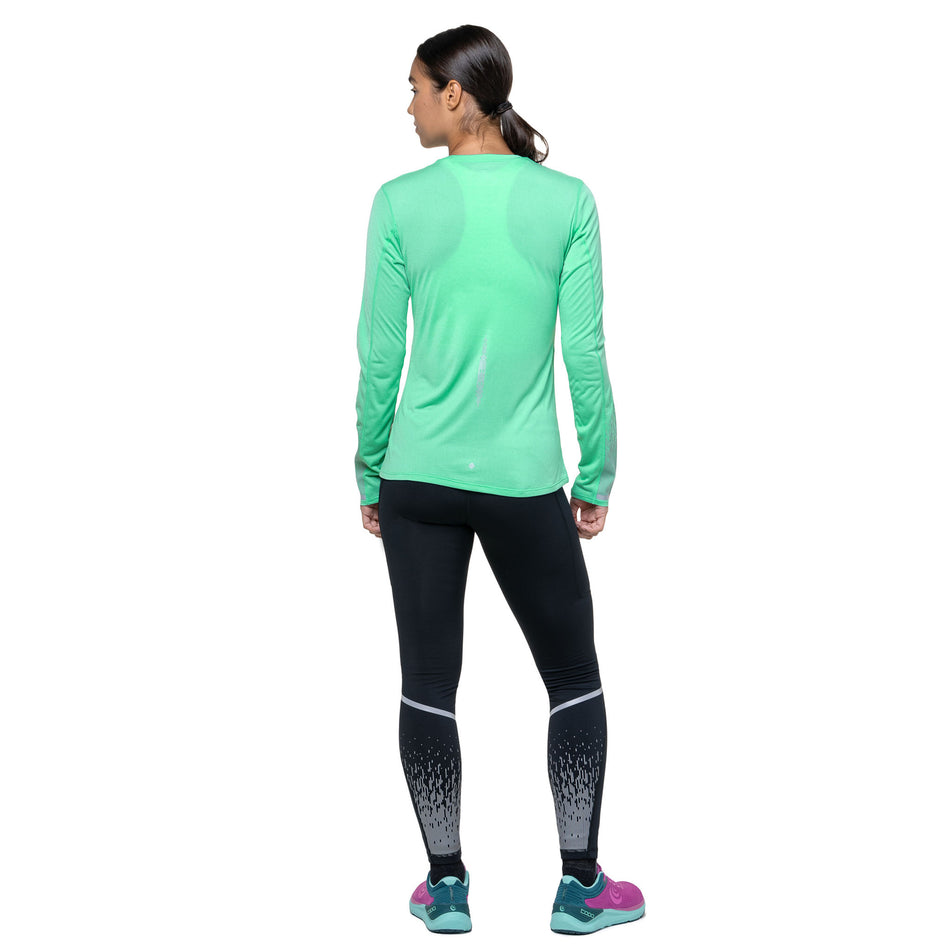 Back view of a model wearing the Ronhill Women's Tech Reflect L/S Tee in the Florida Marl/Reflect colourway. (8747546378402)
