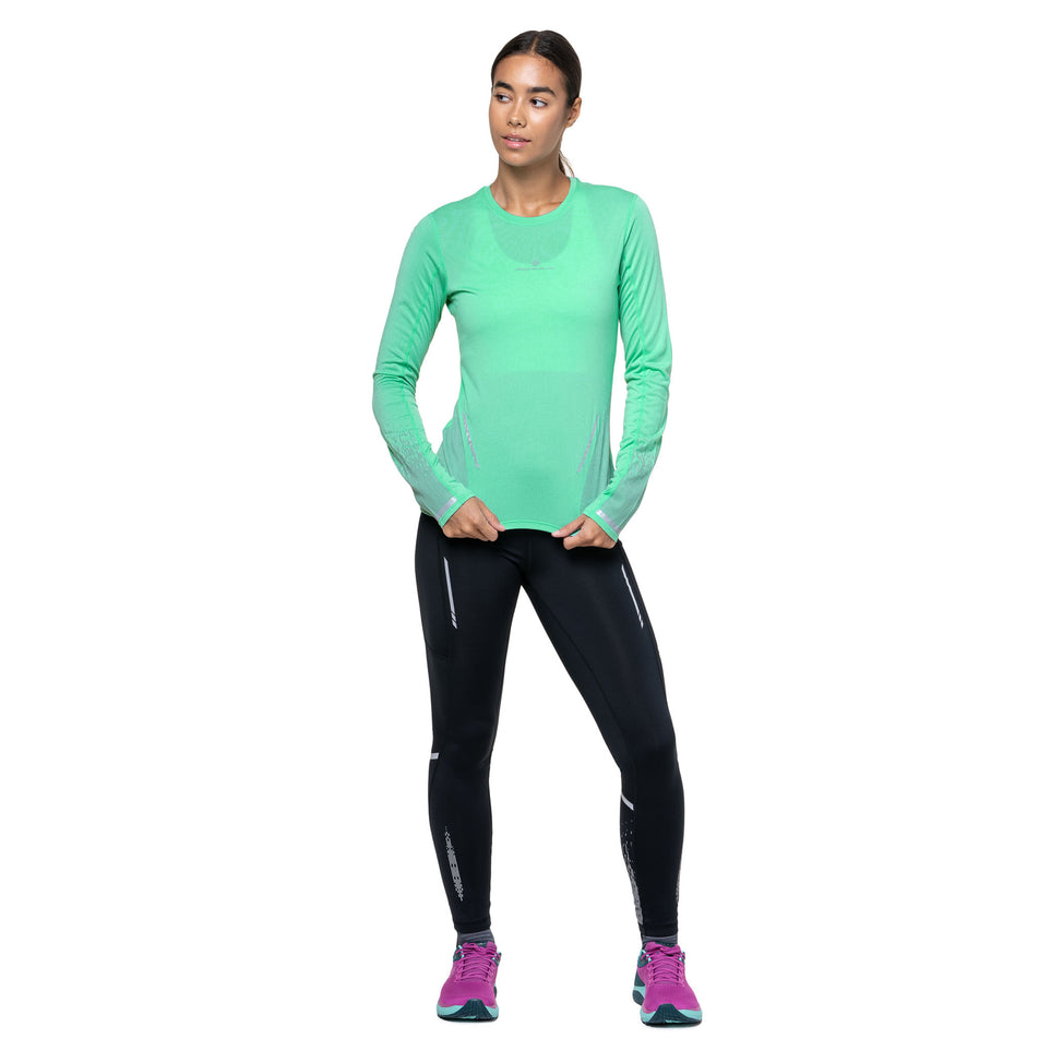 Front view of a model wearing the Ronhill Women's Tech Reflect L/S Tee in the Florida Marl/Reflect colourway. (8747546378402)