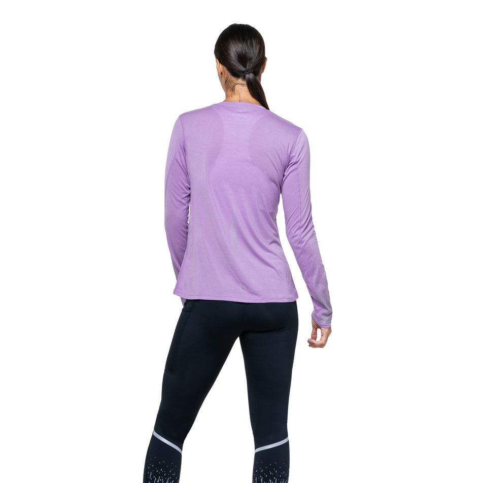 Back view of a model wearing the Ronhill Women's Tech Reflect L/S Tee in the Iris Marl/Reflect colourway. (8747542347938)