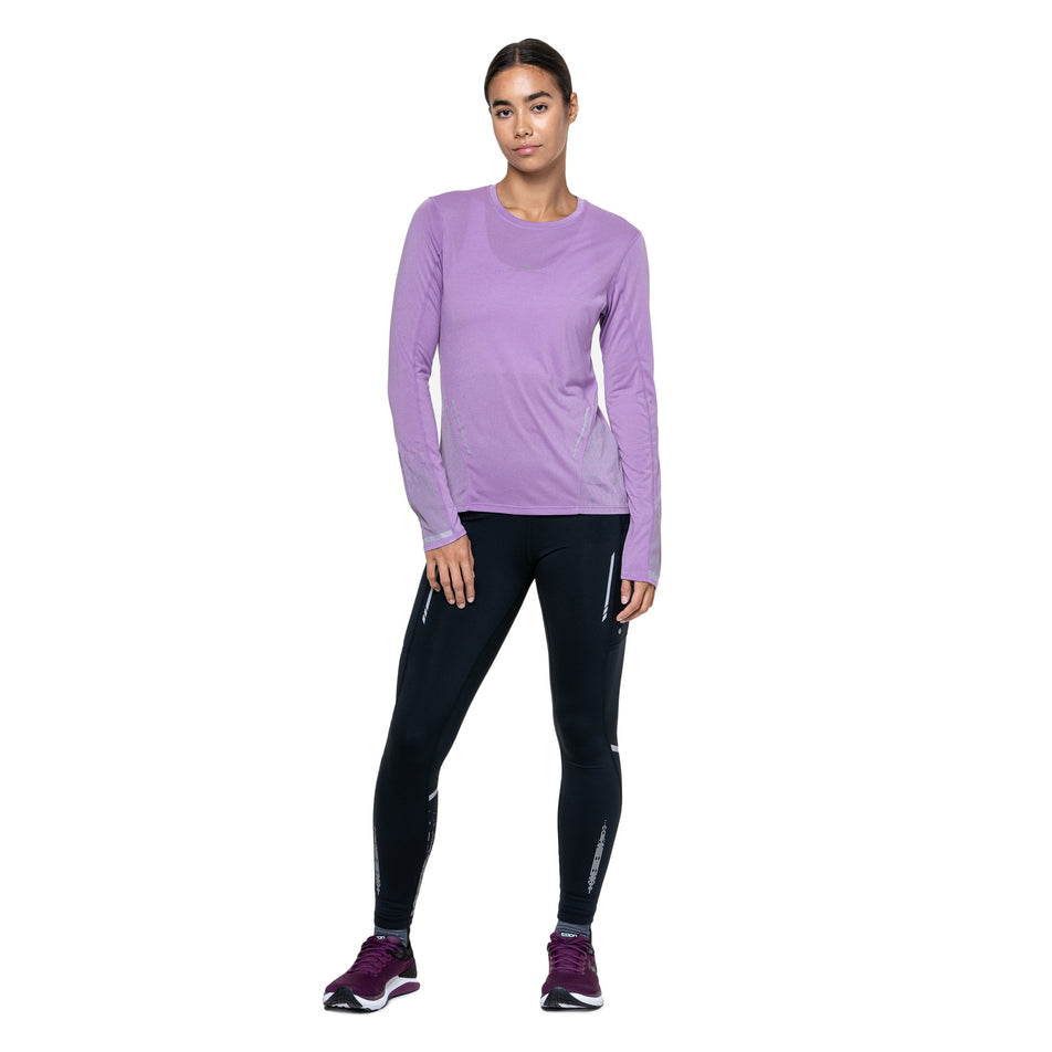 Front view of a model wearing the Ronhill Women's Tech Reflect L/S Tee in the Iris Marl/Reflect colourway. (8747542347938)