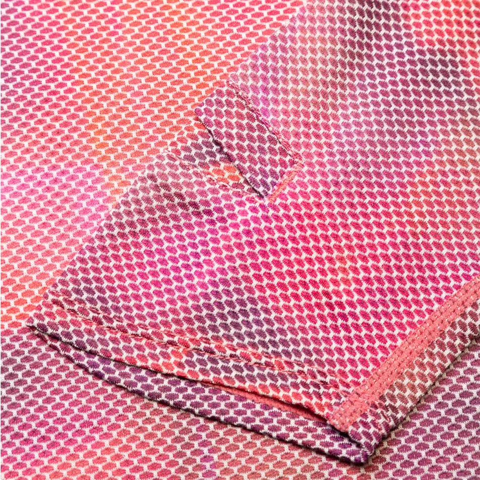 Close-up view of the Ronhill Women's Tech Golden Hour L/S Tee's fabric. (8490078666914)