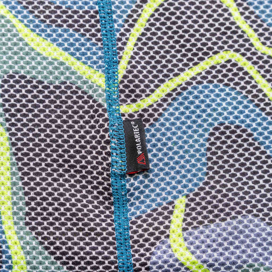 Close-up view of the fabric and Polartec logo on the Ronhill Men's Tech Golden Hour L/S Tee. (8490280550562)