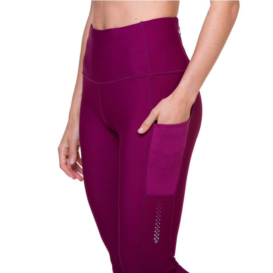 A model demonstrating the pocket on the left-thigh of the Ronhill Women's Tech Winter Tight. (8489915777186)