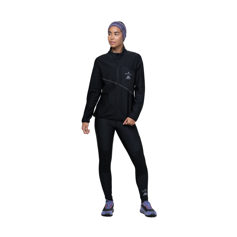 Front view of a model wearing the Ronhill Women's Tech GORE-TEX Windstopper Jacket in the All Black colourway. (8742206898338)