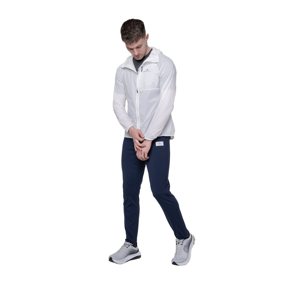 Front view of a model wearing the Ronhill Men's Tech All-Terrain Jacket in the Bright White colourway.