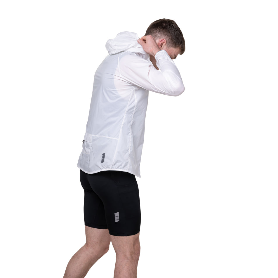 Side view of a model wearing the Ronhill Men's Tech All-Terrain Jacket in the Bright White colourway.