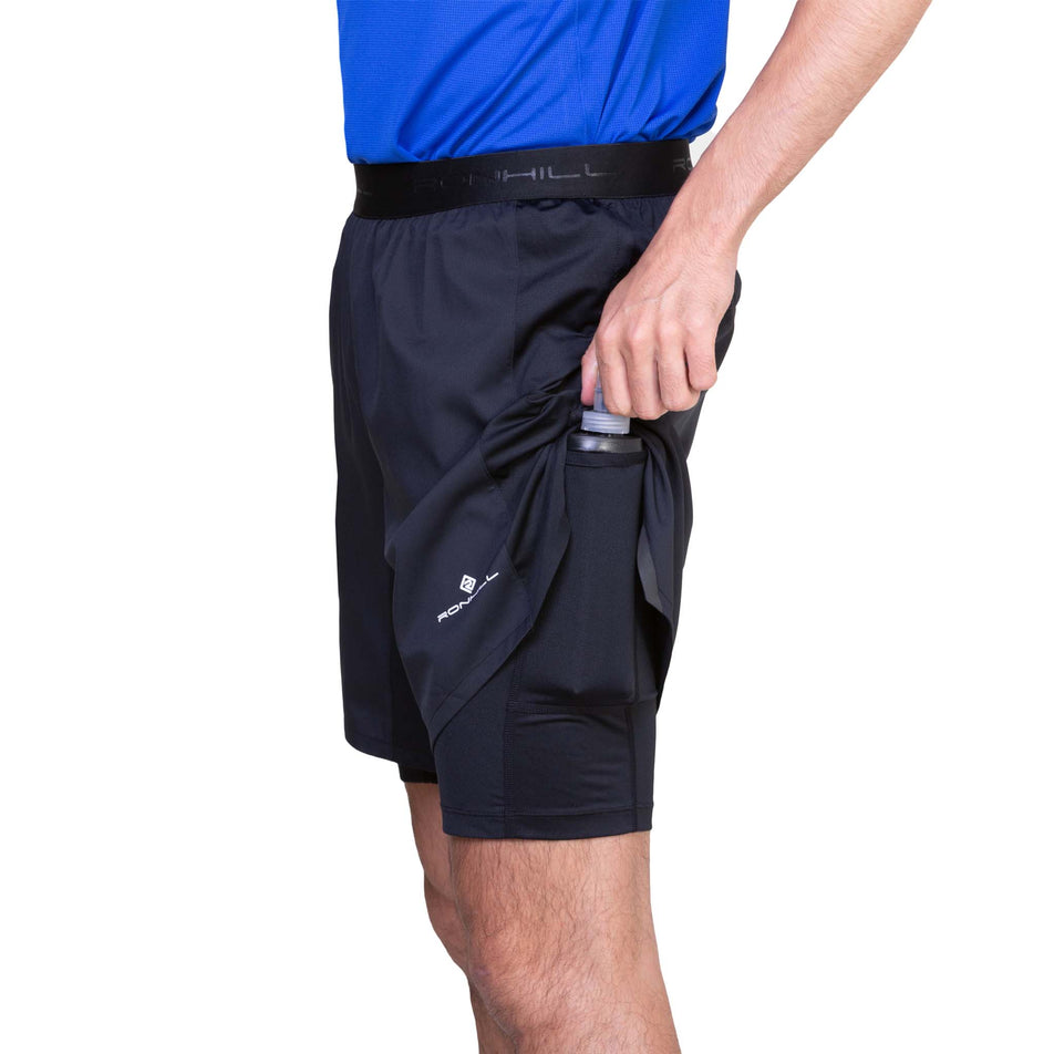 Angled view of a model wearing the Ronhill Men's Tech 7