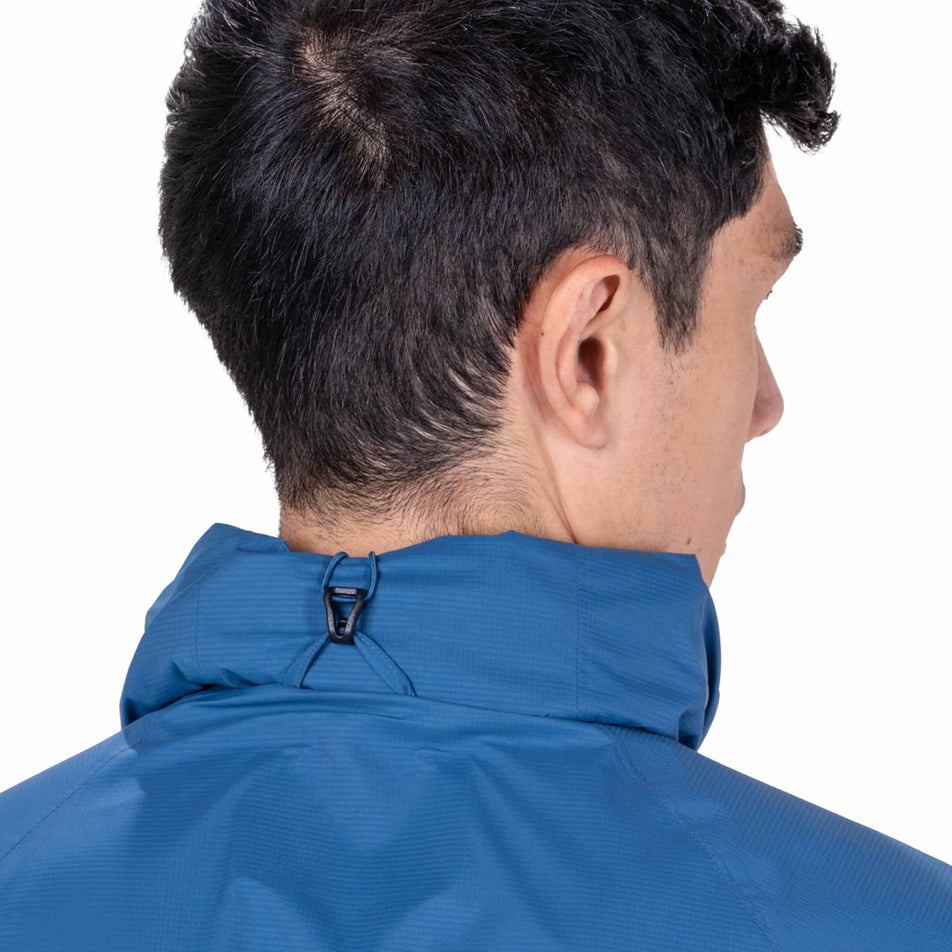 The hood on the Ronhill Men's Tech Storm Jacket in the Glacier/Ronhill Red colourway rolled away.