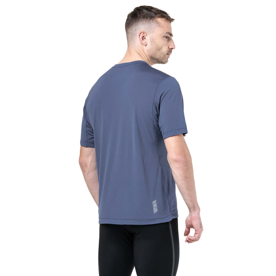 Back view of a model wearing the Ronhill Men's Tech S/S Tee in the Anchor/Electric Blue colourway. (8742891225250)