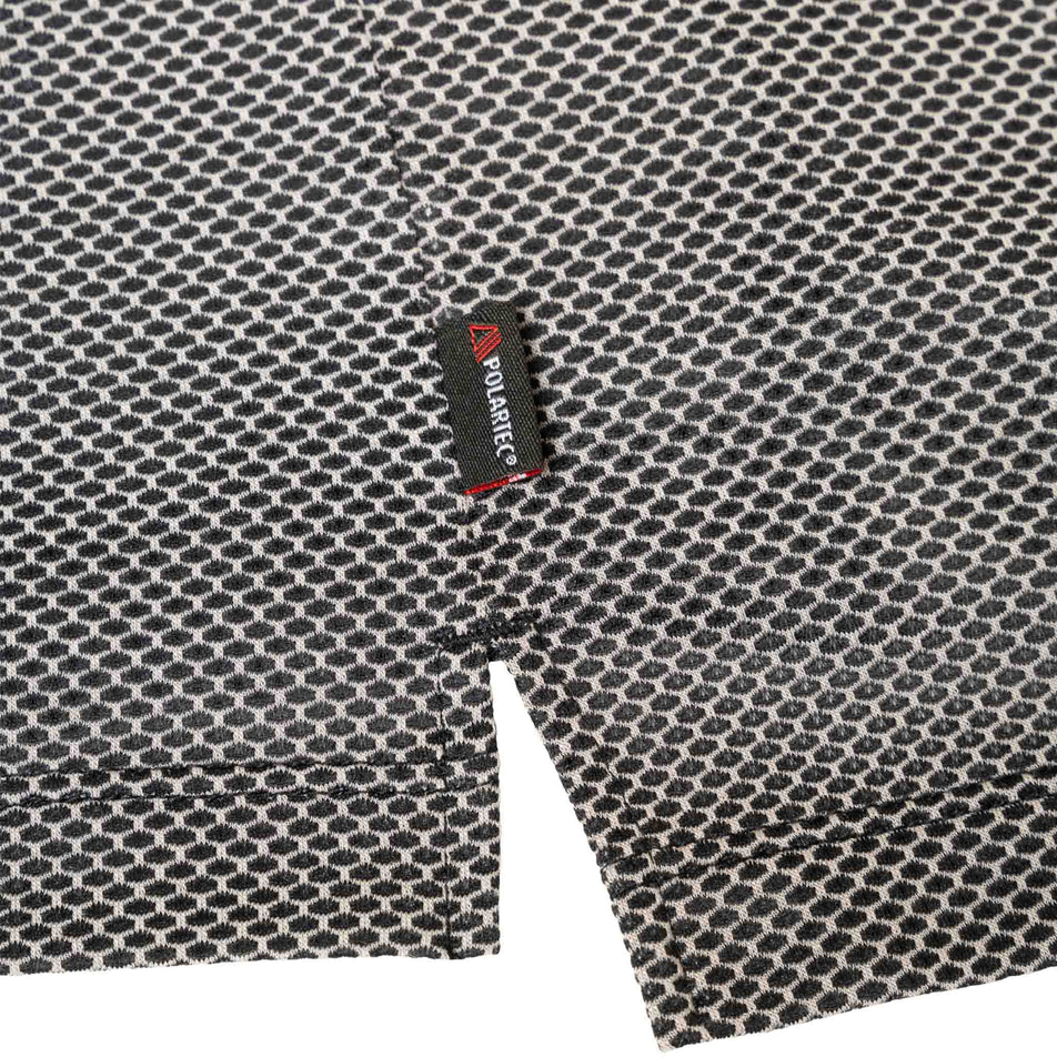The Polartec label on the Ronhill Men's Tech Golden Hour Tank in the Black/Matrix colourway. (8565239283874)