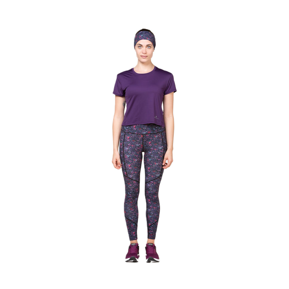 Front view of a model wearing the Ronhill Women's Tech Breathe S/S Tee Damson colourway. (8581018550434)