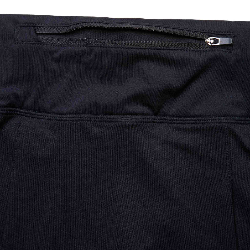 The zip pocket on the back of the Ronhill Women's Tech Skort in the All Black colourway. (8581024678050)