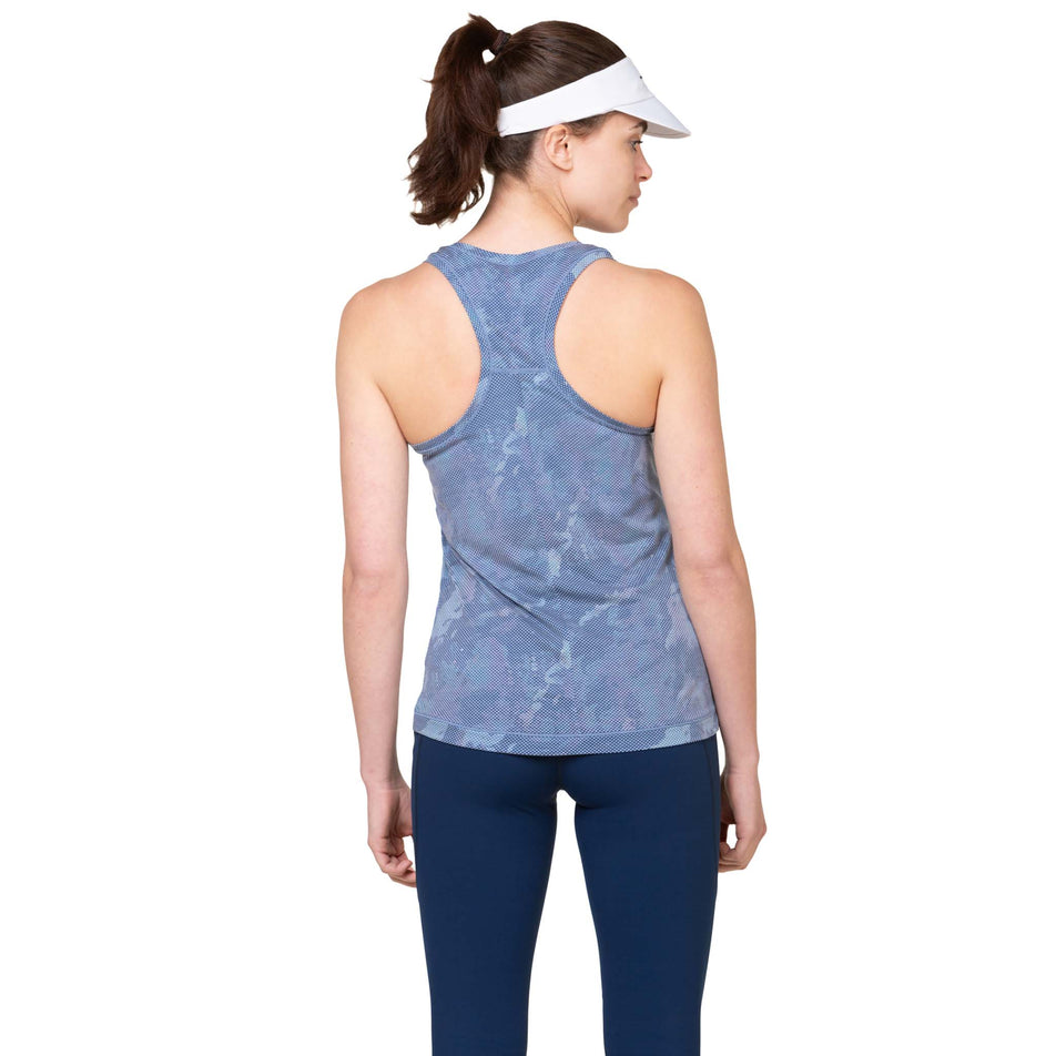 Back view of a model wearing the Ronhill Women's Tech Golden Hour Vest inTidal Watercolour colourway. (8583469039778)