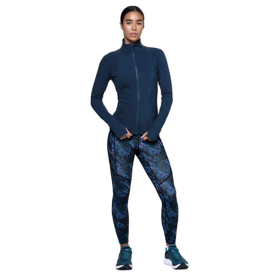 Front view of a model wearing the Ronhill Women's Tech Contour Jacket in the Dark Navy colourway. (8742703693986)