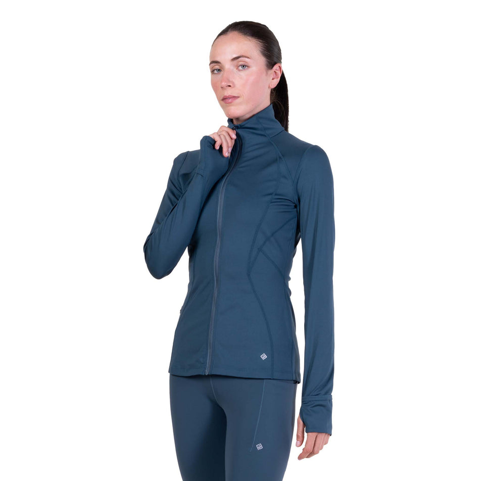 Front view of a model wearing the Ronhill Women's Tech Contour Jacket in the Evening Haze colourway.