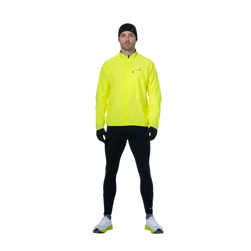 Front view of a model wearing the Ronhill Men's Core Jacket in the Fluo Yellow/Black colourway. (8742893551778)