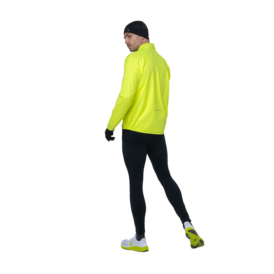 Back view of a model wearing the Ronhill Men's Core Jacket in the Fluo Yellow/Black colourway. (8742893551778)