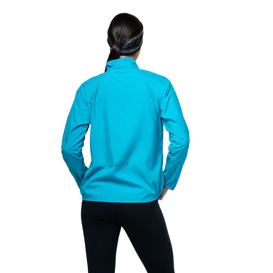 Back view of a model wearing the Ronhill Women's Core Jacket in the Azure/Bright White colourway. (8747610931362)