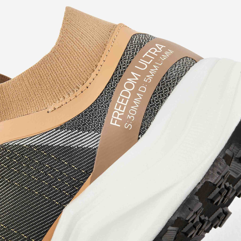 Close-up of the bootie ankle collar on the left shoe from a pair of Ronhill Men's Freedom Ultra Running Shoes in the Sand colourway. (8601908314274)