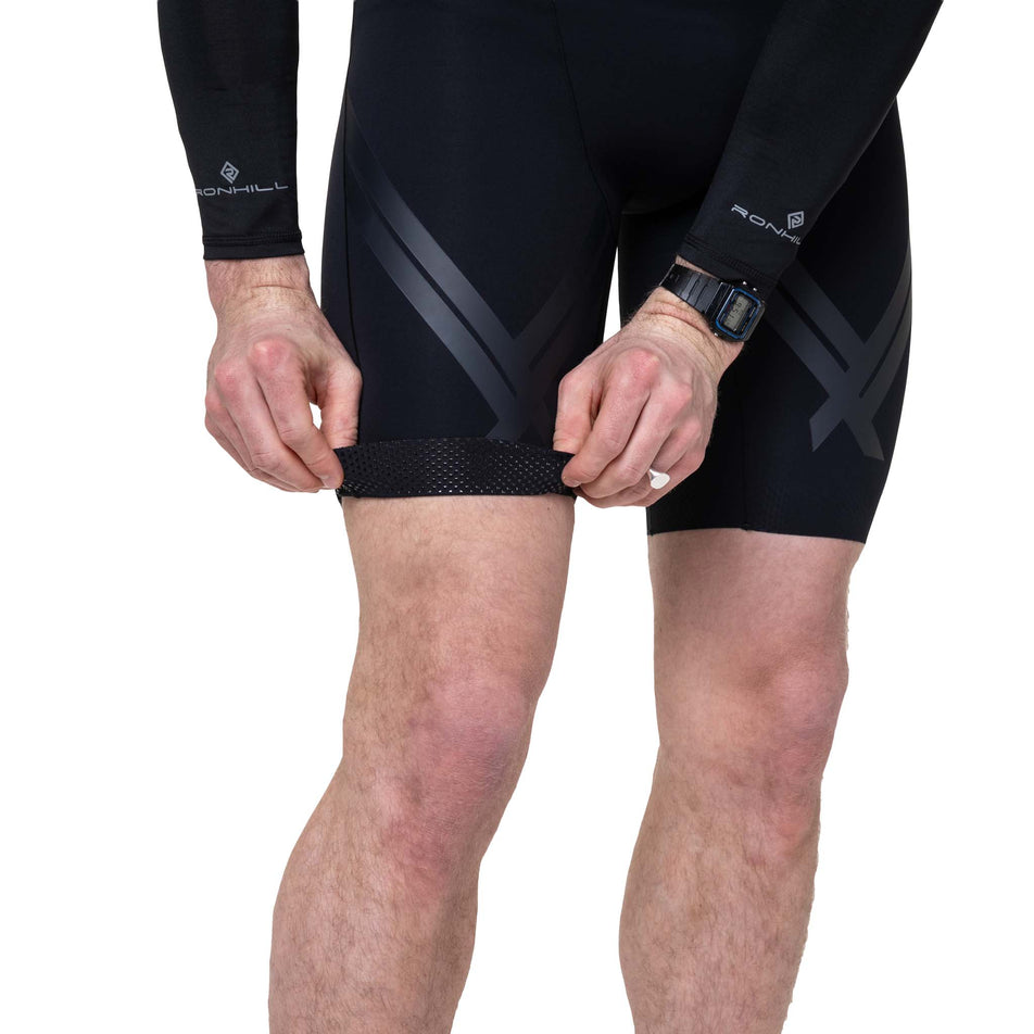 The gripper design at the end of the leg of the Ronhill Men's Tech Race Half Tight in the All Black colourway.