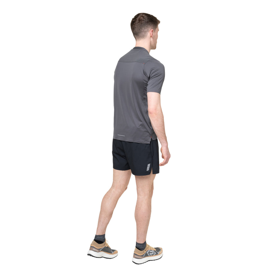 Back view of a model wearing the Ronhill Men's Tech All-Terrain S/S Tee in the Oxide colourway.