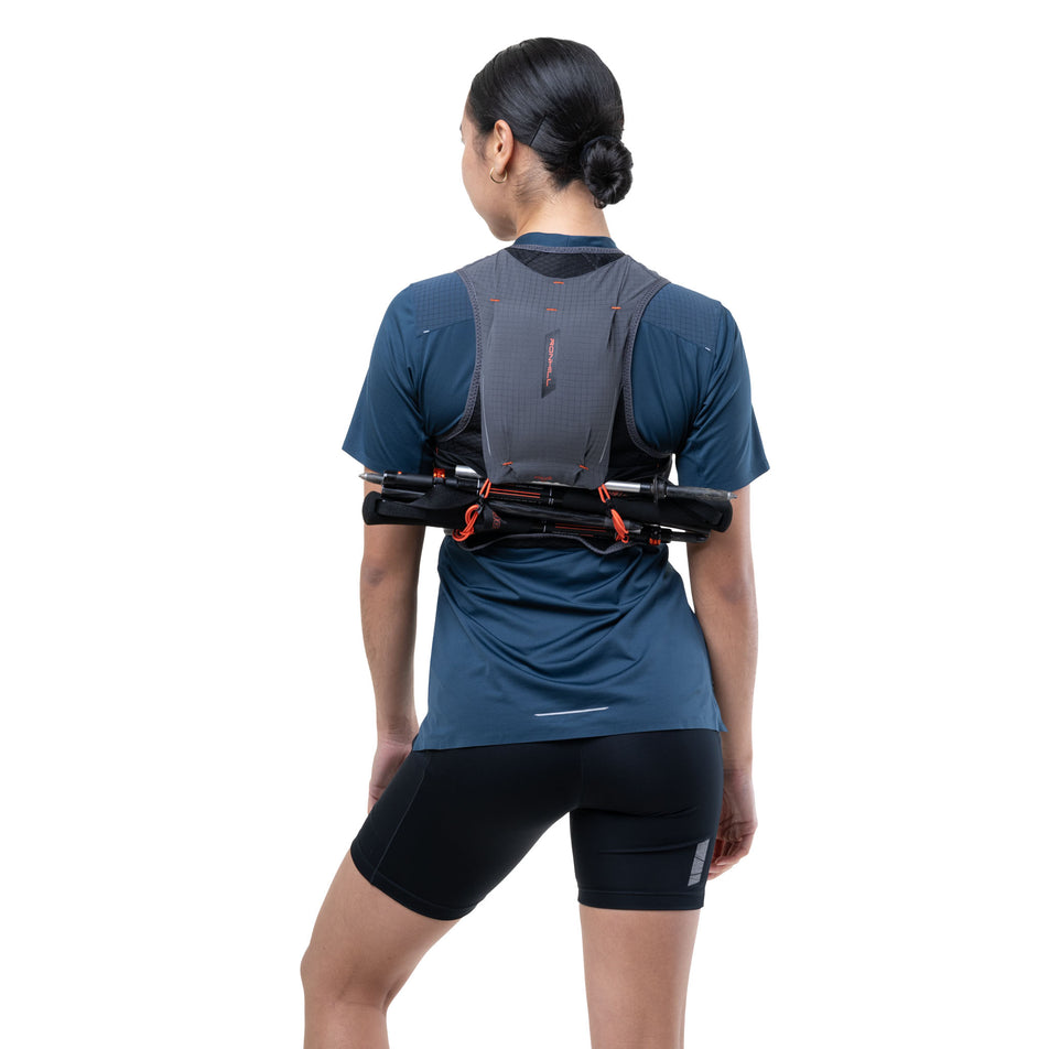 Back view of a model wearing the Ronhill Unisex Solus 5L in the Black/Ronhill Red colourway.