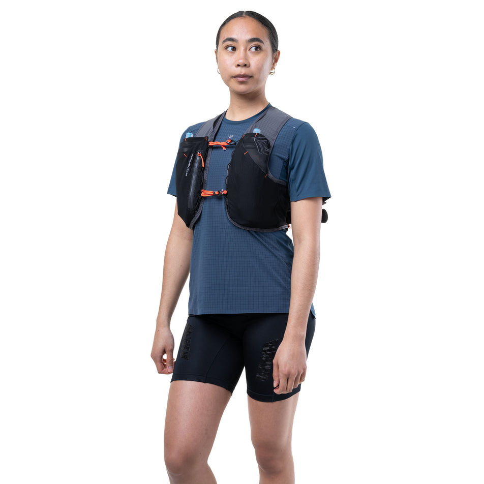 Front view of a model wearing the Ronhill Unisex Solus 5L in the Black/Ronhill Red colourway.