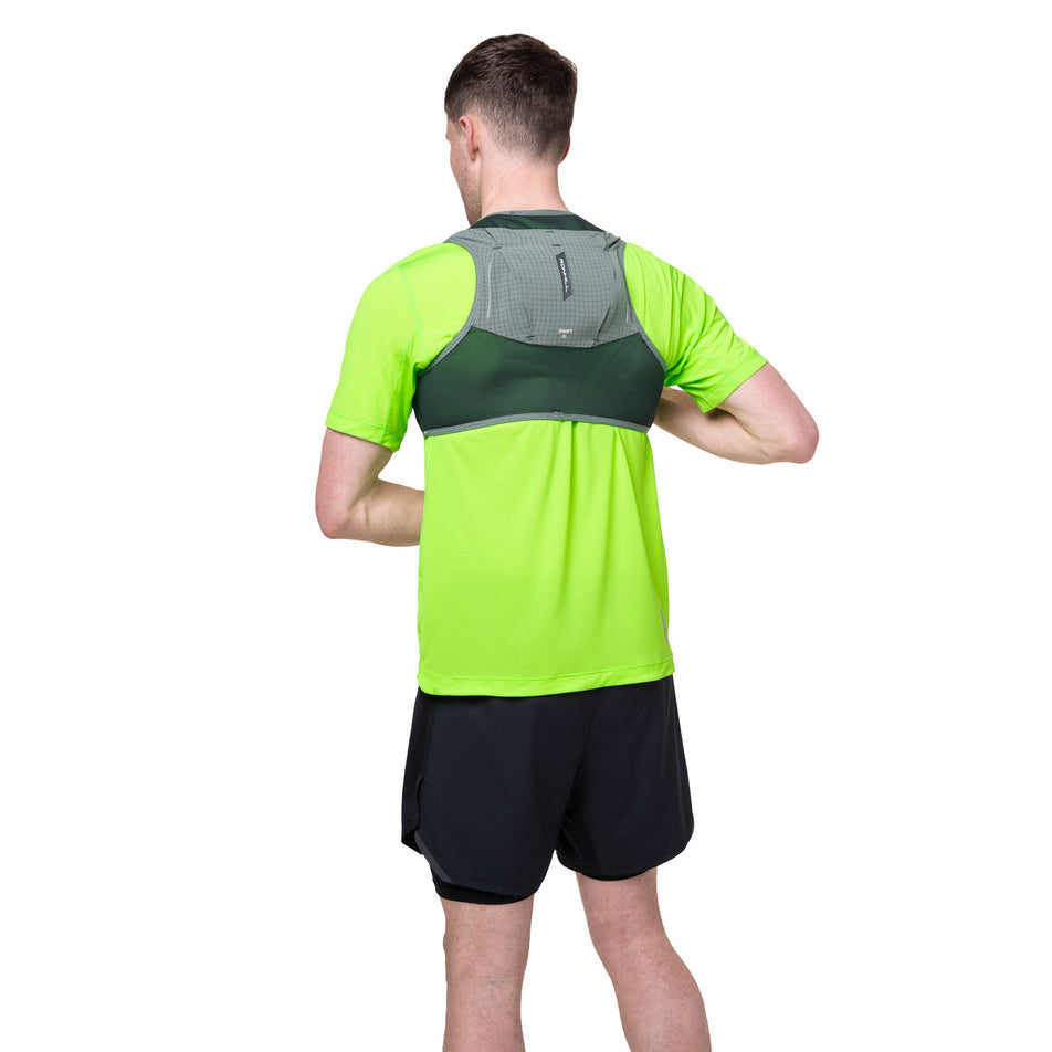 Back view of a model wearing the Ronhill Unisex Swift 2L in the Laurel/Dark Laurel colourway.