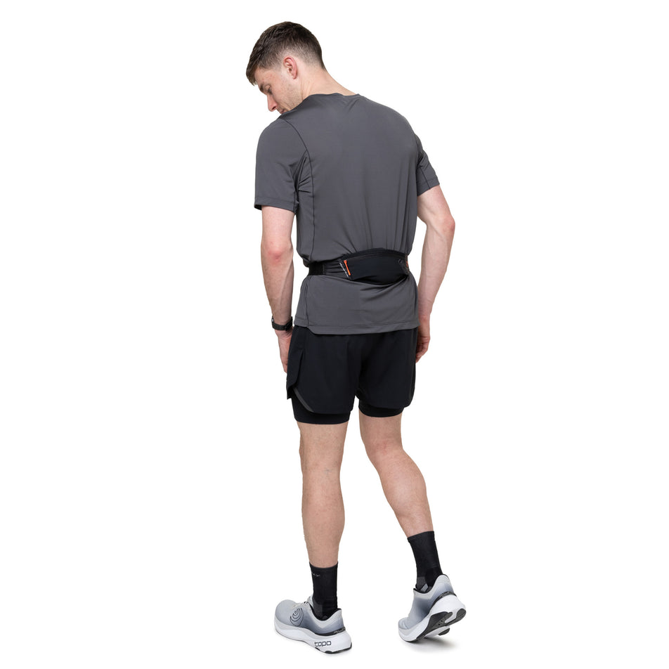 Back view of a model wearing the Ronhill Unisex Speed 90 in the Black/Ronhill Red colourway.