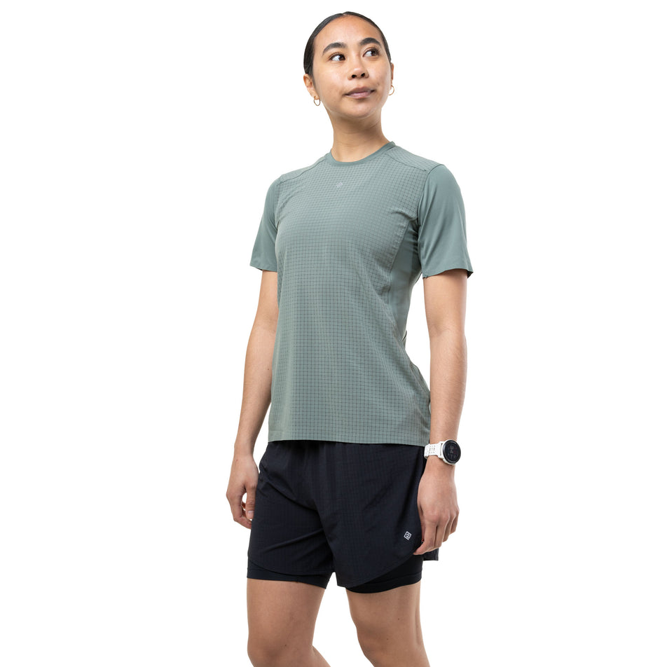 Front view of a model wearing the Ronhill Women's Tech All-Terrain S/S Tee in the Laurel colourway.