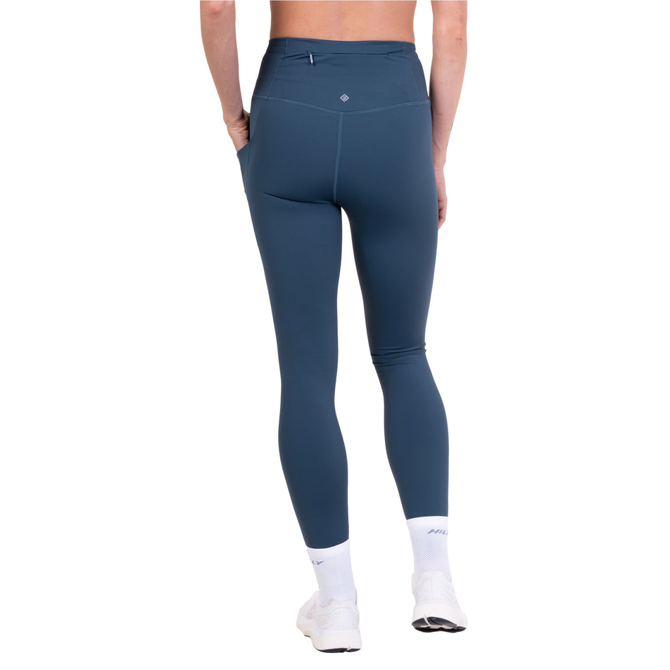 Back view of a model wearing the Ronhill Women's Tech Contour Tight in the Evening Haze colourway.