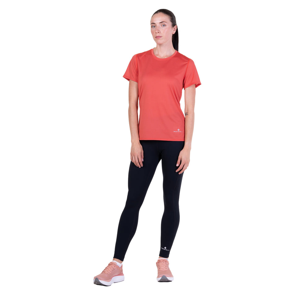 Front view of a model wearing the Ronhill Women's Core S/S Tee in the Sumac colourway.