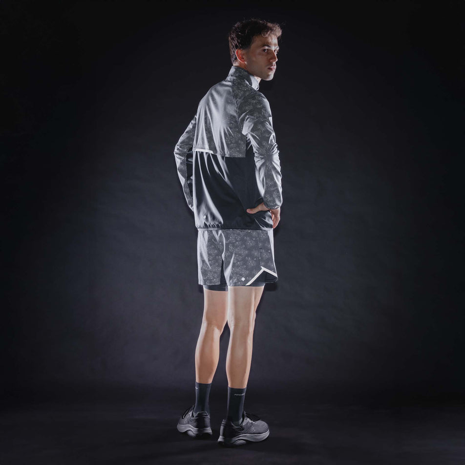 The reflective print on the Ronhill Men's Tech Reflect Lux Jacket in the Black/Reflect colourway.