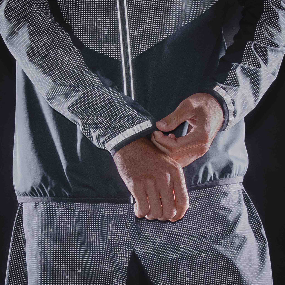 The reflective print on the Ronhill Men's Tech Reflect Lux Jacket in the Black/Reflect colourway.