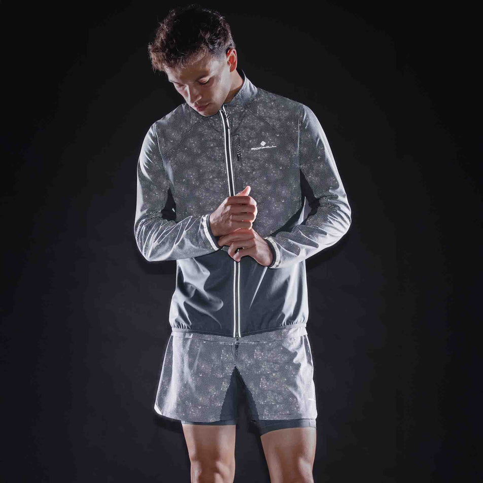 The reflective print on the Ronhill Men's Tech Reflect Lux Jacket in the Black/Reflect colourway.