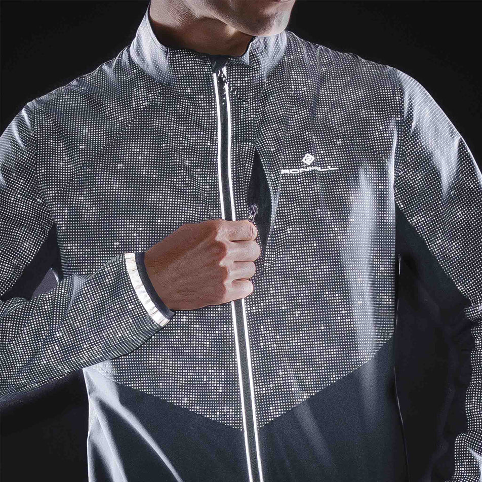 The reflective print on the Ronhill Men's Tech Reflect Lux Jacket in the Black/Reflect colourway.