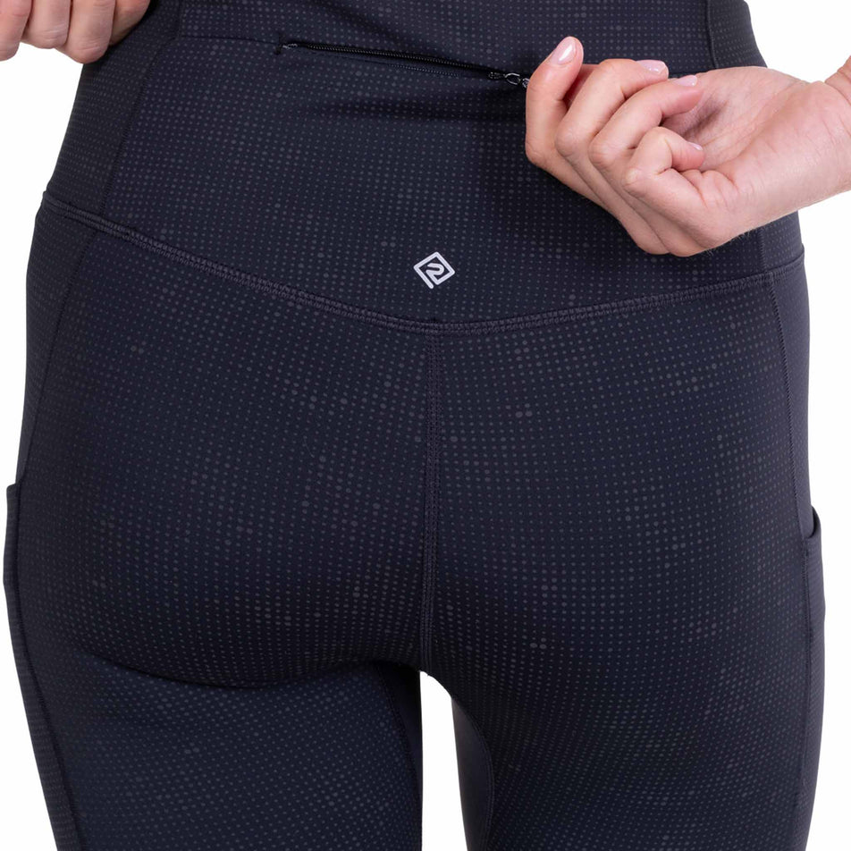 The zip pocket on the back of the Ronhill Women's Tech Reflect Lux Tight in the Black/Reflect colourway.