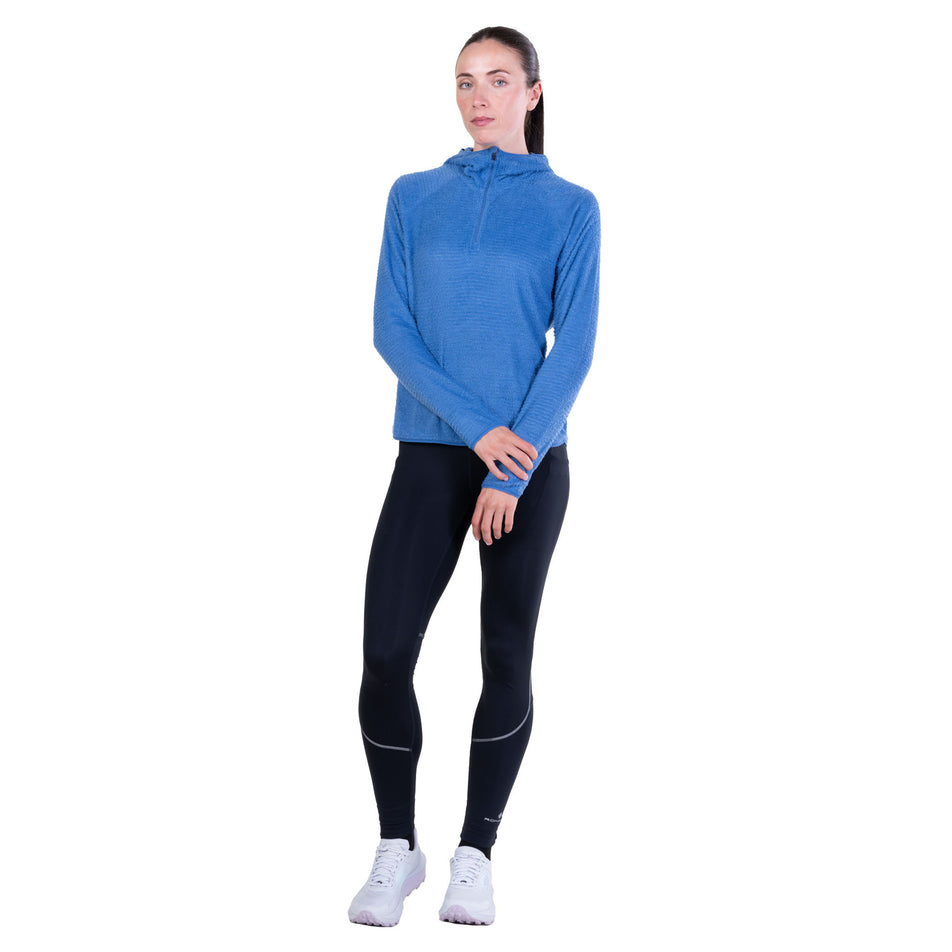 Front view of a model wearing the Ronhill Women's Tech Winter Primaloft Hoodie in the Lumiere/Sumac colourway.