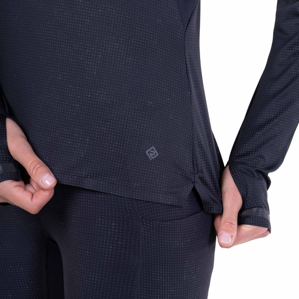 The Ronhill logo on the Ronhill Women's Tech Reflect Lux L/S Tee in the Black/Reflect colourway.