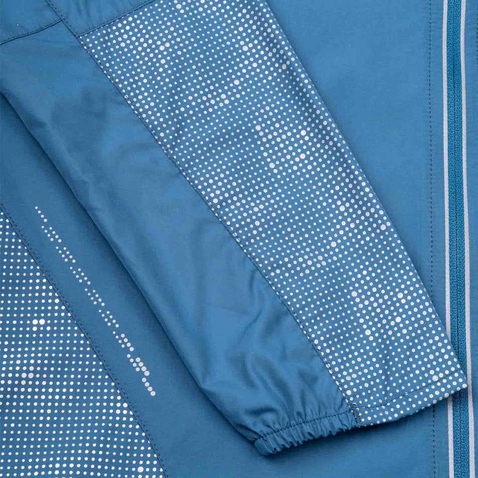 Close-up view of the reflective pattern on the Ronhill Women's Tech Reflect Jacket in the Legion Blue/Reflect colourway.