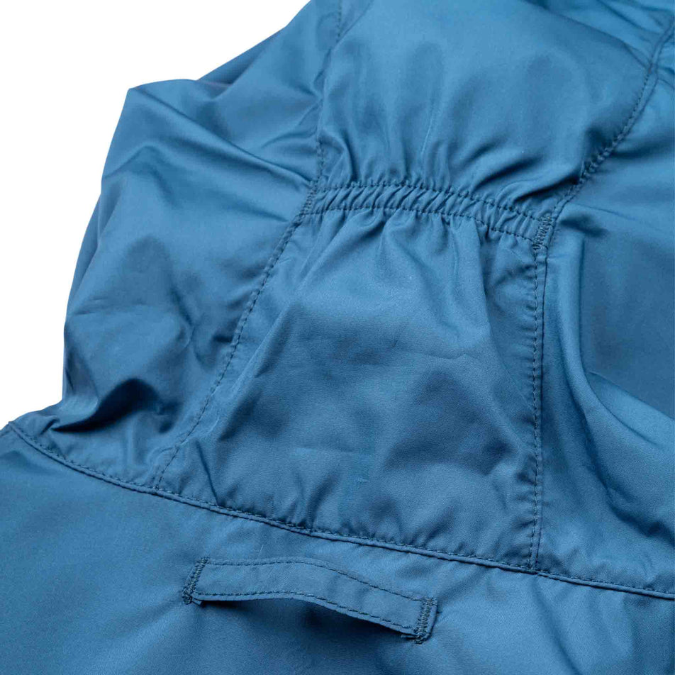 The back of the hood of the Ronhill Women's Tech Reflect Jacket in the Legion Blue/Reflect colourway.